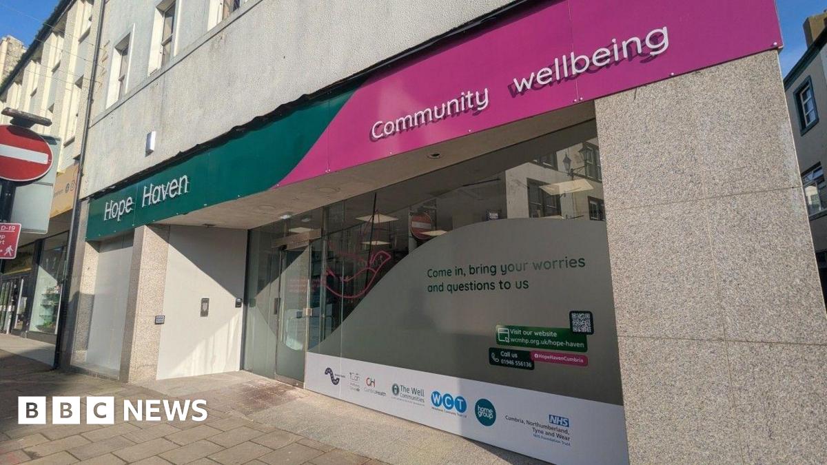 A general view of the Hope Haven hub. The premises are on the ground floor at the corner of a street. The front has large shop-style windows, partially frosted. A sign reads Hope Haven on a green and pink background.