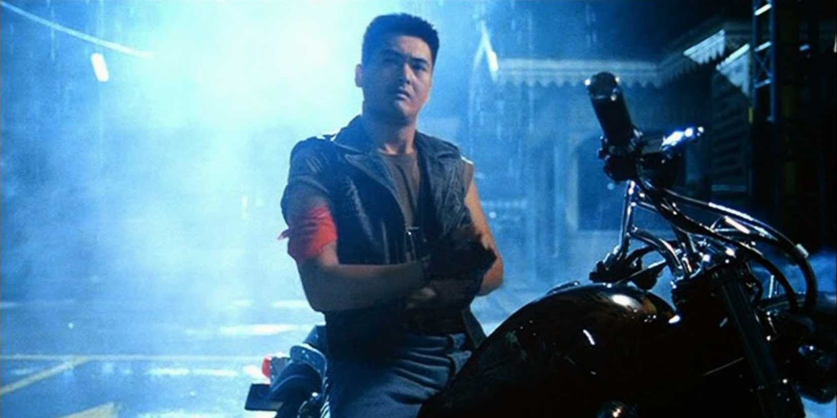 Chow Yun-fat with his arms crossed on a bike in Full Contact