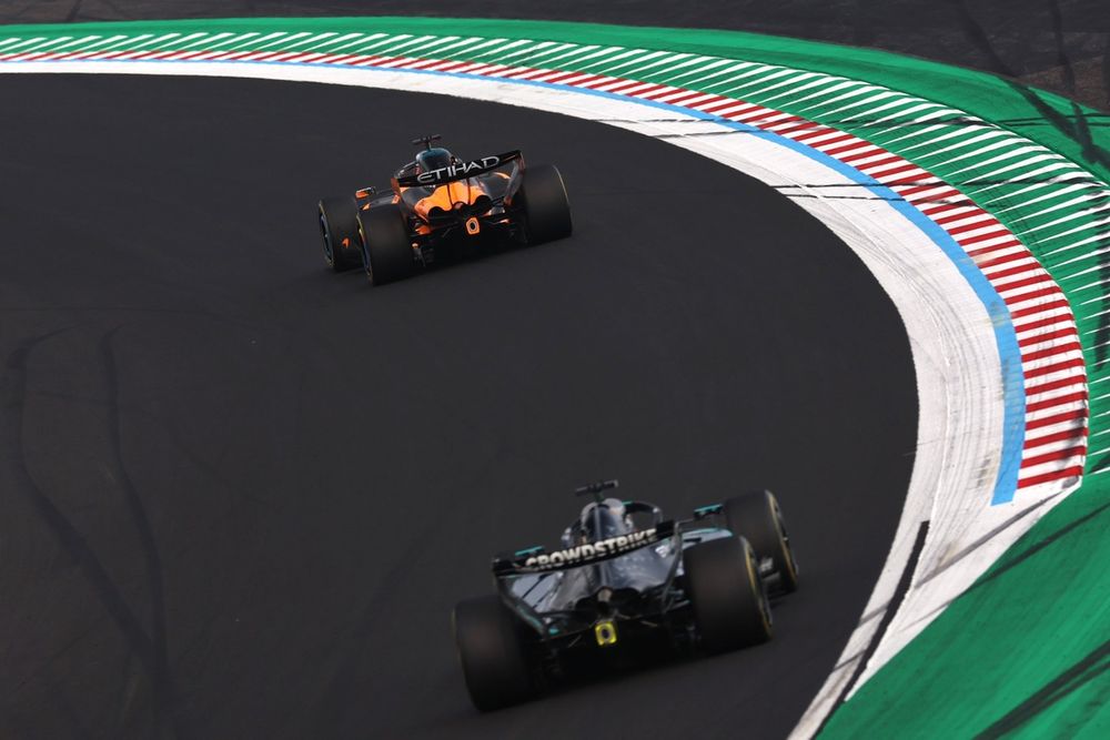 Mercedes' George Russell chasing the McLaren of Piastri.