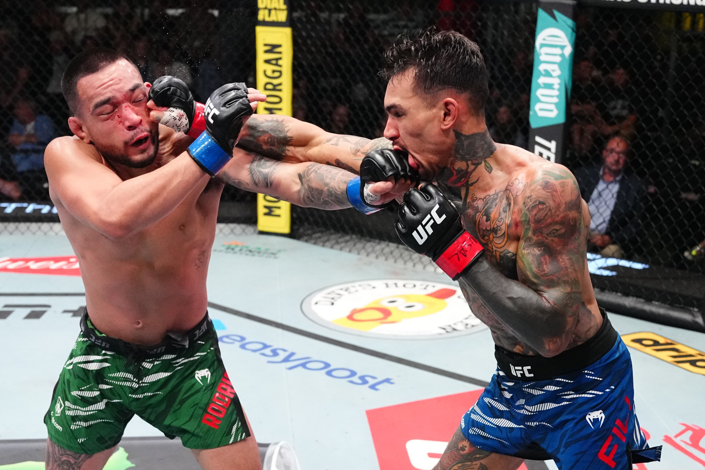 LAS VEGAS, NEVADA - AUGUST 09: (R-L) Andre Fili and Christian Rodriguez trade punches in a featherweight fight during the UFC Fight Night event at UFC APEX on August 09, 2025 in Las Vegas, Nevada. (Photo by Jeff Bottari/Zuffa LLC)