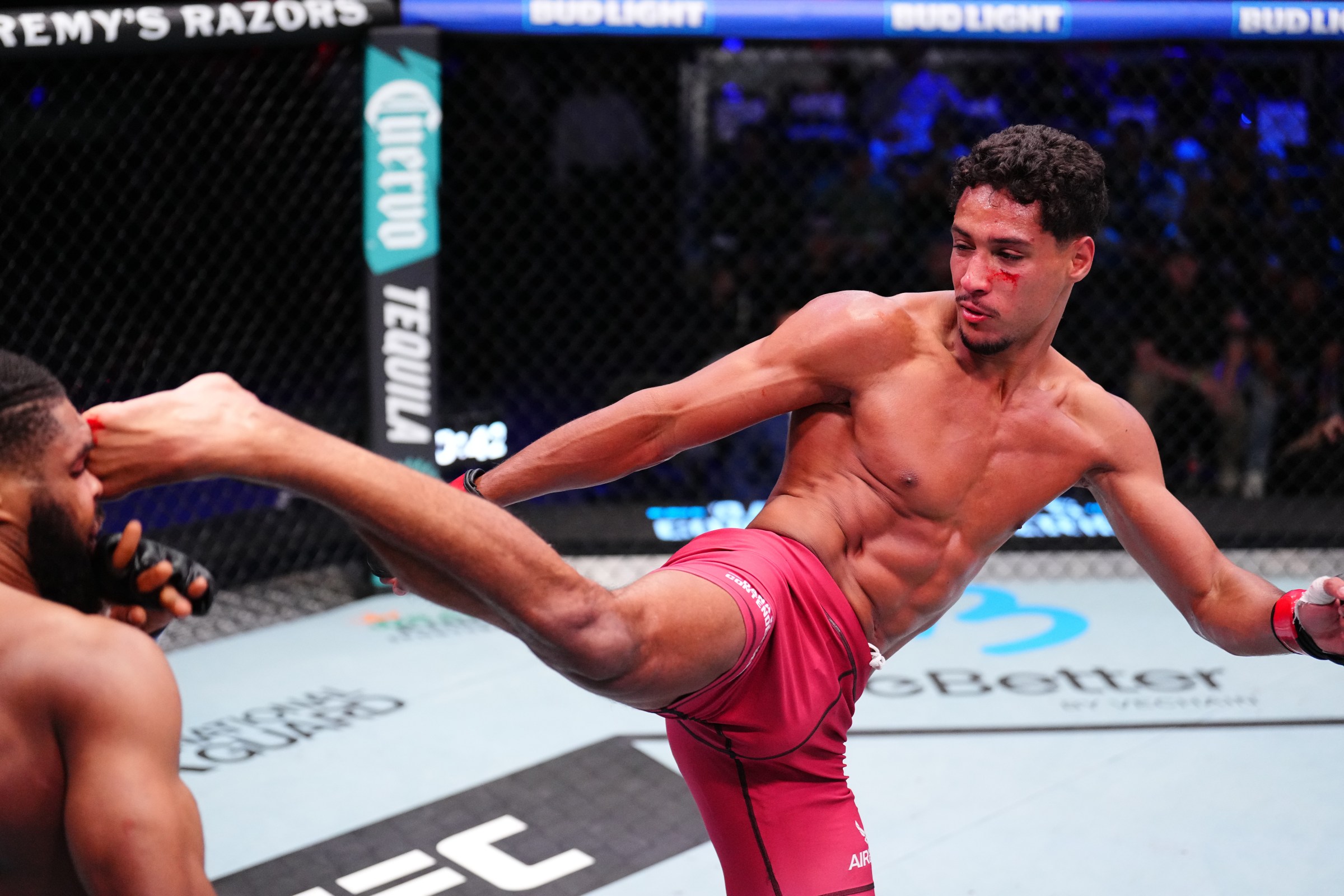 LAS VEGAS, NEVADA - OCTOBER 14: (R-L) Marwan Rahiki of Morocco kicks Ananias Mulumba of The Democratic Republic of Congo in a featherweight fight during Dana White’s Contender Series season nine, week ten at UFC APEX on October 14, 2025 in Las Vegas, Nevada. (Photo by Chris Unger/Zuffa LLC)