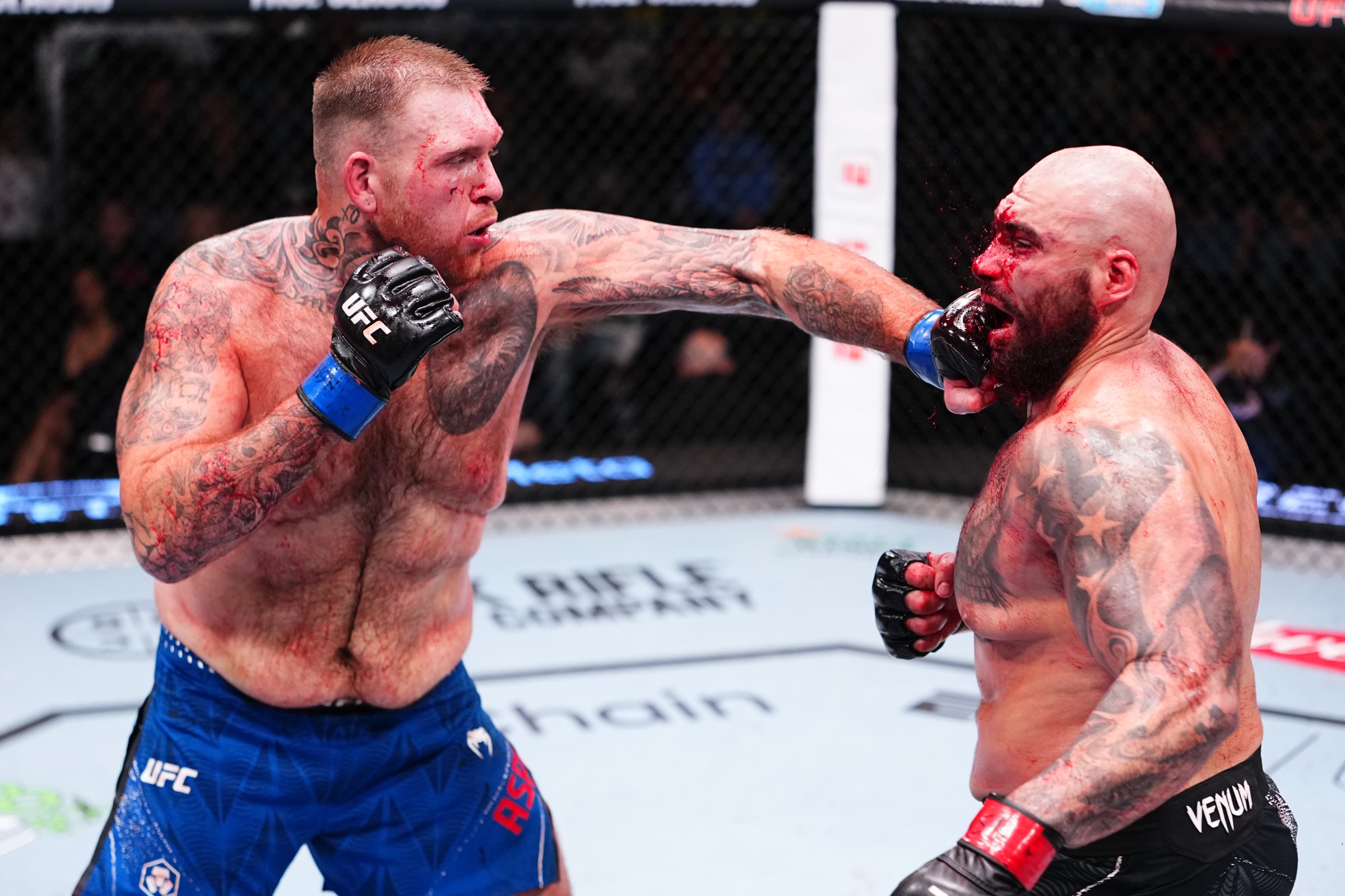 LAS VEGAS, NEVADA - DECEMBER 13: (L-R) Steven Asplund punches Sean Sharaf in a heavyweight fight during the UFC Fight Night event at UFC APEX on December 13, 2025 in Las Vegas, Nevada. (Photo by Jeff Bottari/Zuffa LLC)