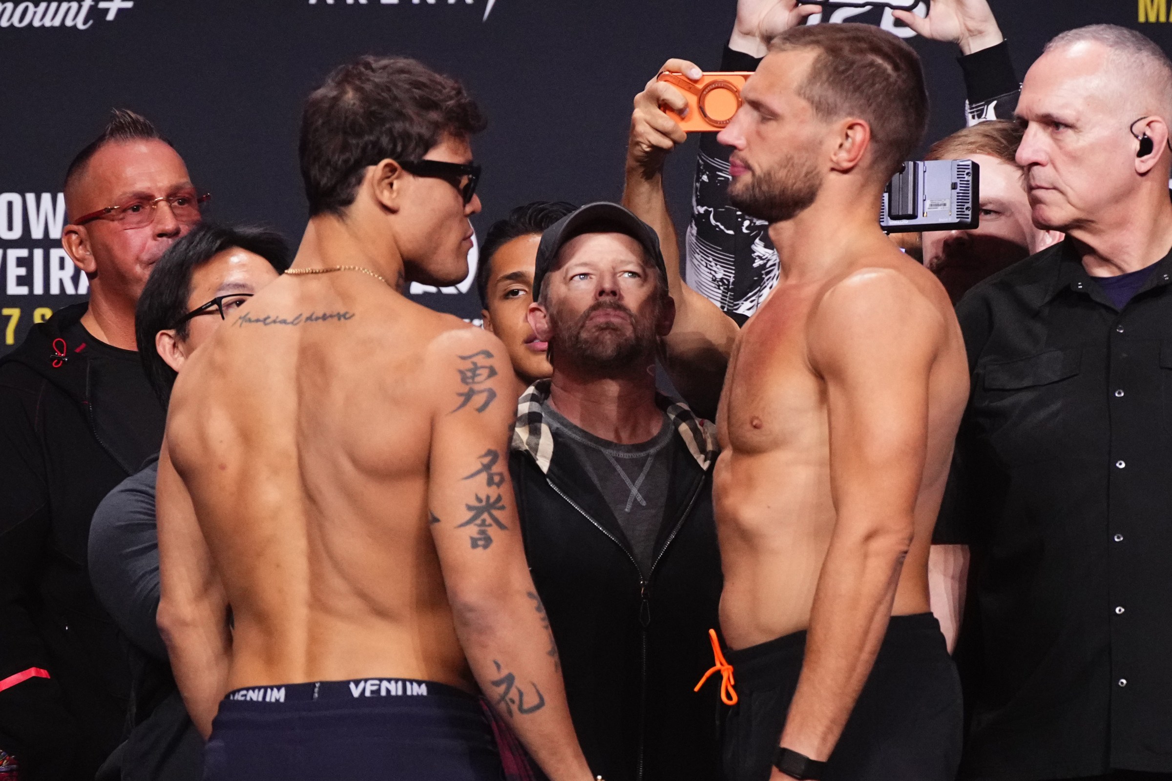 LAS VEGAS, NEVADA - MARCH 06: (L-R) Opponents Caio Borralho of Brazil and Reinier de Ridder of The Netherlands face off during the UFC 326 ceremonial weigh-in at MGM Grand Garden Arena on March 06, 2026 in Las Vegas, Nevada. (Photo by Jeff Bottari/Zuffa LLC)