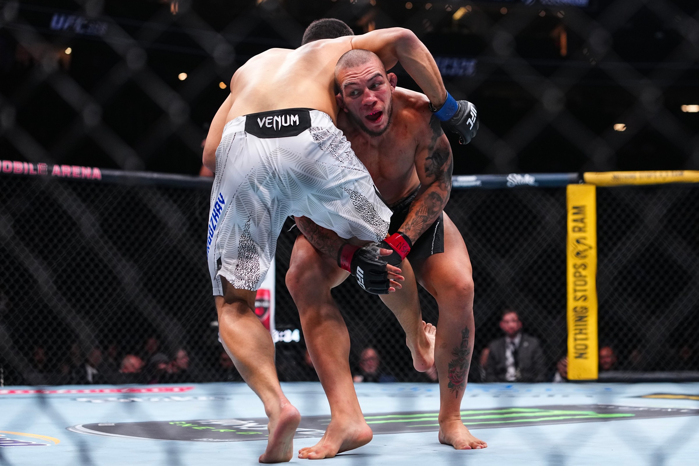 LAS VEGAS, NEVADA - MARCH 07: (R-L) Rafael Tobias of Brazil wrestles Diyar Nurgozhay of Kazakstan in a light heavyweight fight during the UFC 326 event at T-Mobile Arena on March 07, 2026 in Las Vegas, Nevada. (Photo by Chris Unger/Zuffa LLC)