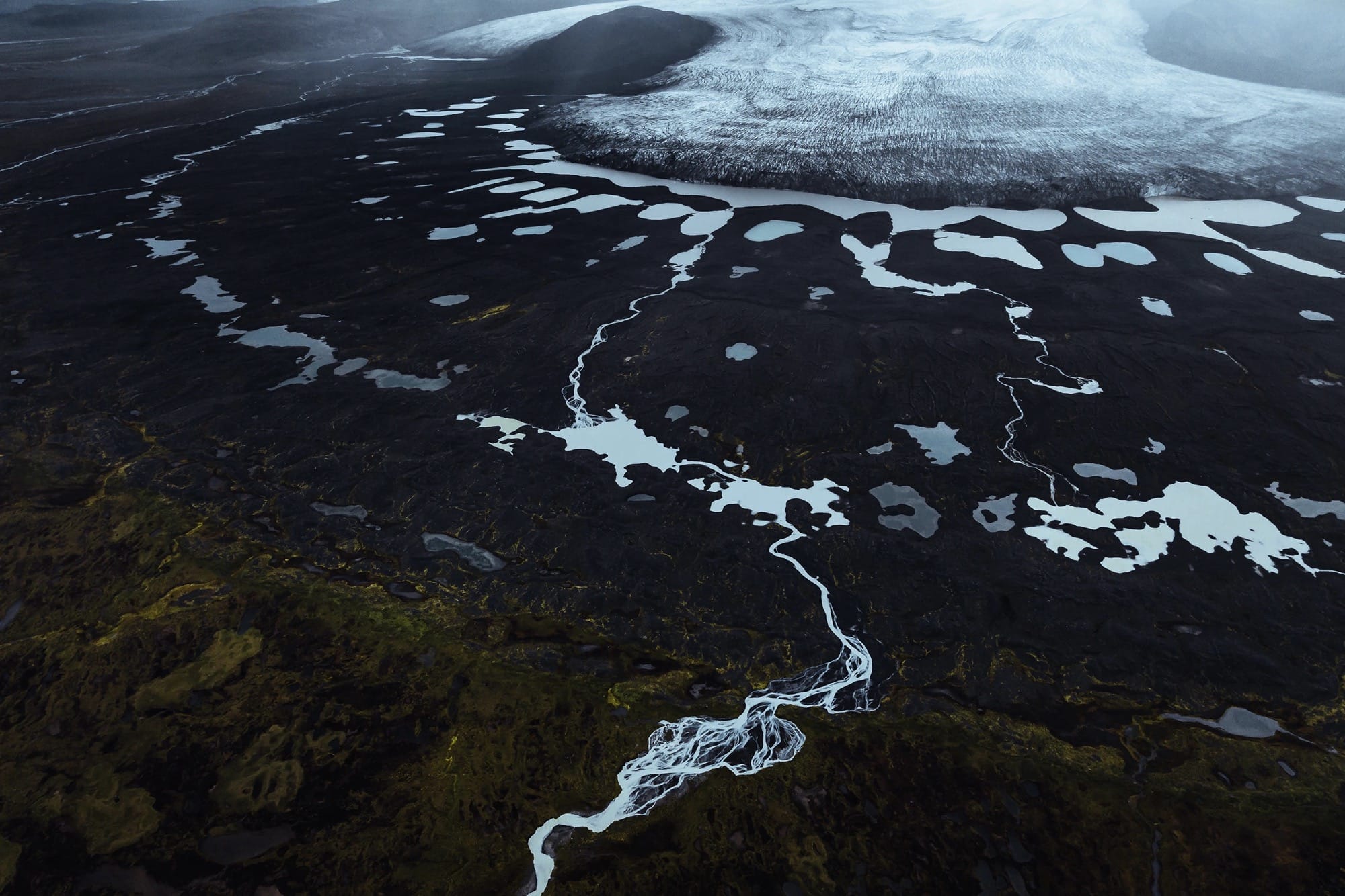 An aerial landscape of glacial streams in Iceland