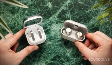 hands holding the samsung galaxy buds 4 pro vs technics az1000