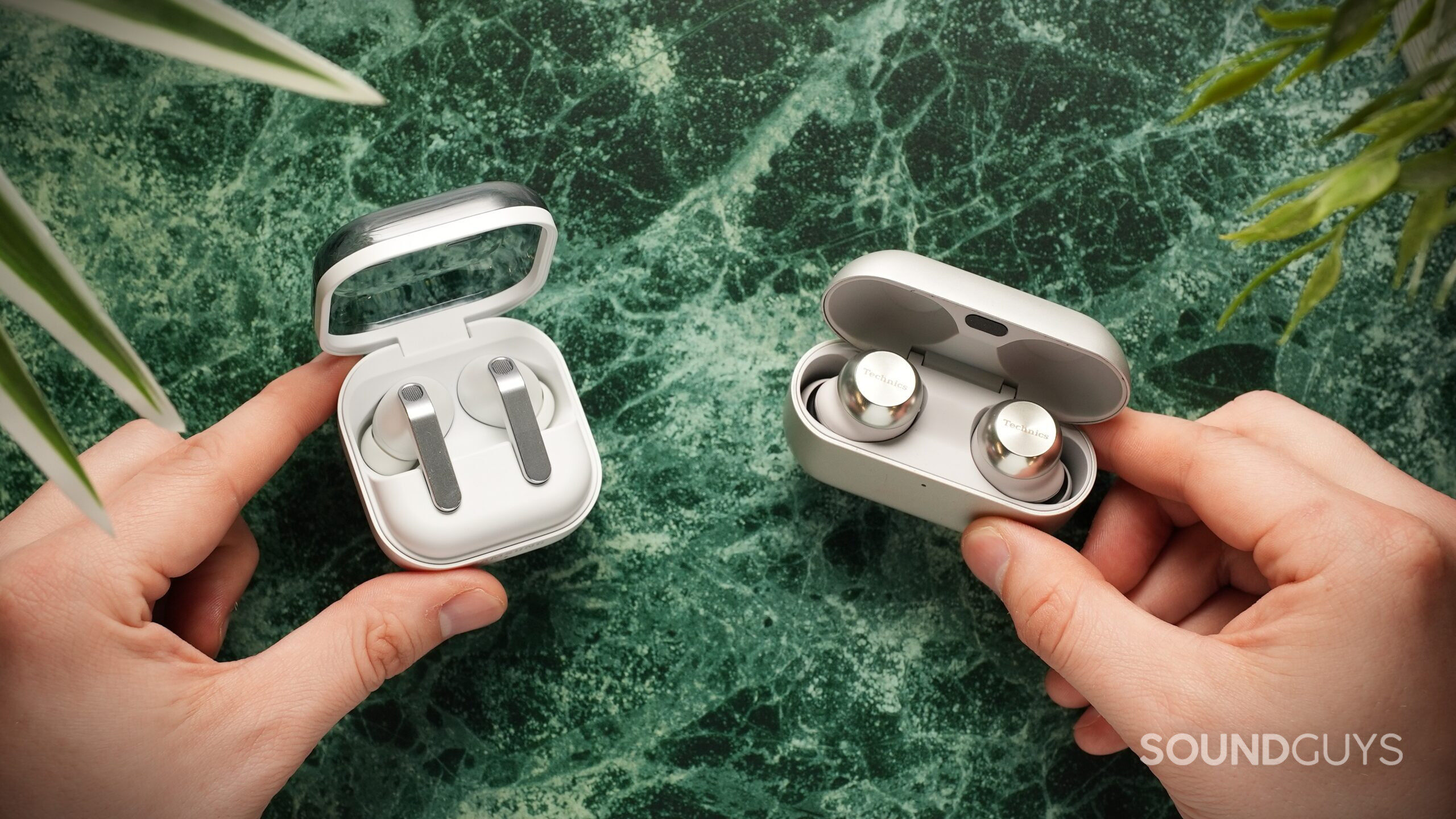 hands holding the samsung galaxy buds 4 pro vs technics az1000 hands holding the samsung galaxy buds 4 pro vs technics az1000