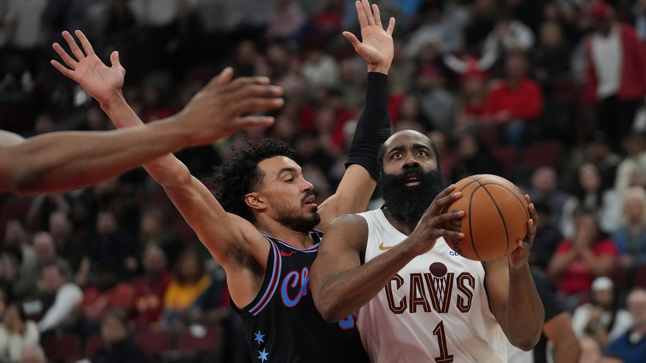 Cleveland Cavaliers guard James Harden (1), right, handles the ball as Chicago Bulls guard Tre Jones (30) defends during the second half of an NBA basketball game Thursday, March 19, 2026, in Chicago. (AP Photo/Erin Hooley)