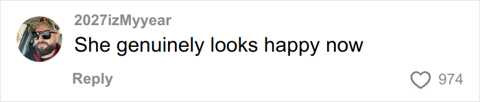 Comment saying she genuinely looks happy now, posted by user 2027izMyyear with 974 likes on a social media platform.