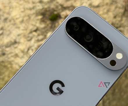 Google Pixel 10 Pro XL held up against brown rock