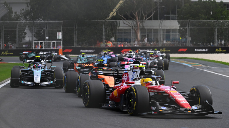 Lewis Hamilton of Great Britain driving the (44) Scuderia Ferrari SF-26 leads Lando Norris of Great Britain driving the (1) McLaren MCL40 Mercedes at the start during the F1 Grand Prix of Australia at Albert Park Grand Prix Circuit on March 08, 2026 in Melbourne, Australia.