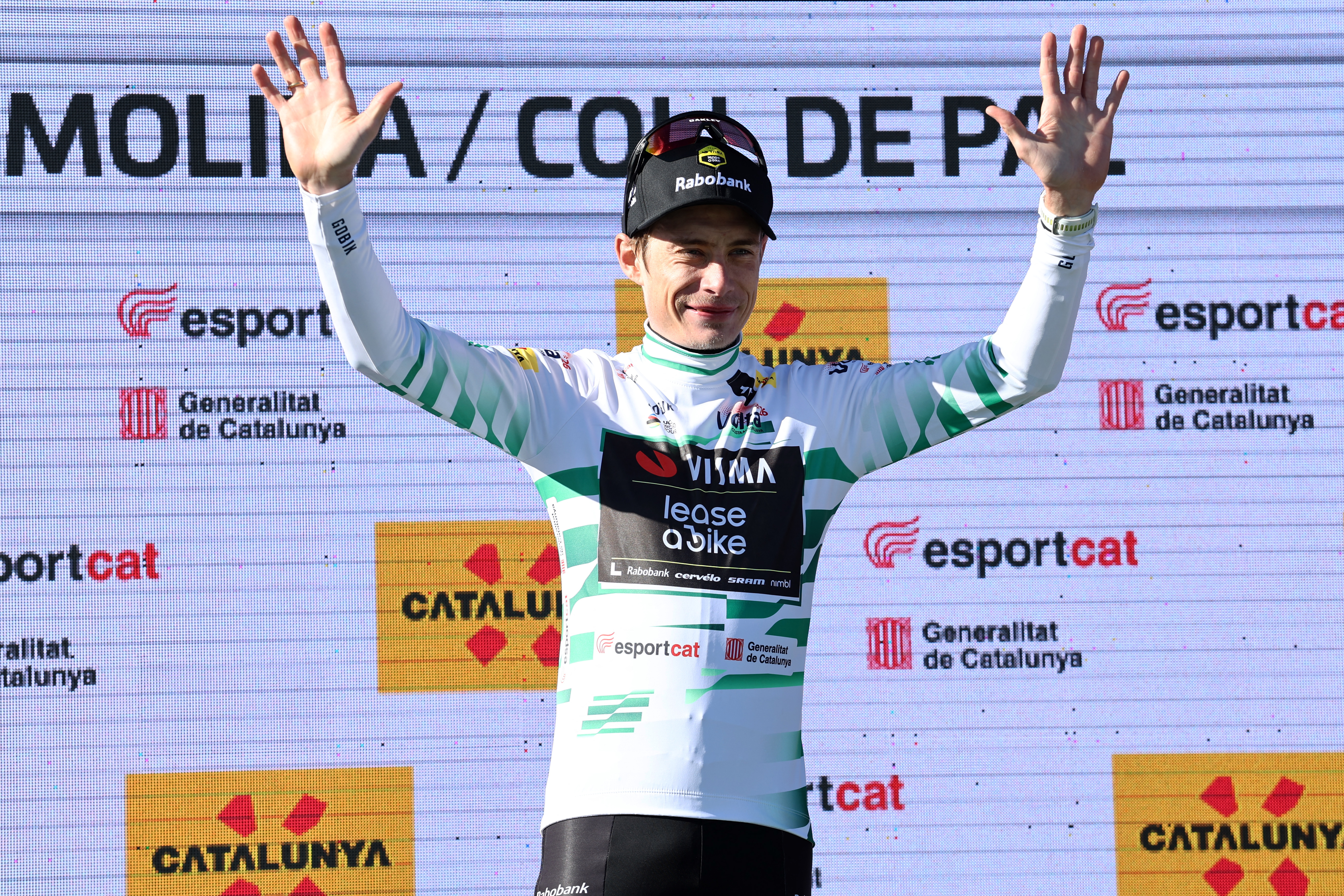 Stage winner Team Visma-Lease a bike's Danish rider Jonas Vingegaard celebrates on the podium after becoming the new overall ranking leader after the fifth stage of the 2026 Volta a Catalunya cycling tour of Catalonia, a 155,5 km race between La Seu d'Urgell and La Molina ski resort in Alp, on March 27, 2026. (Photo by Josep LAGO / AFP)