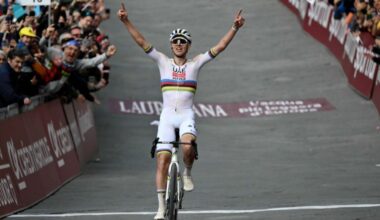 Tadej Pogacar raises his arms aloft after crossing the line to win the Strade Bianche 2025 road race