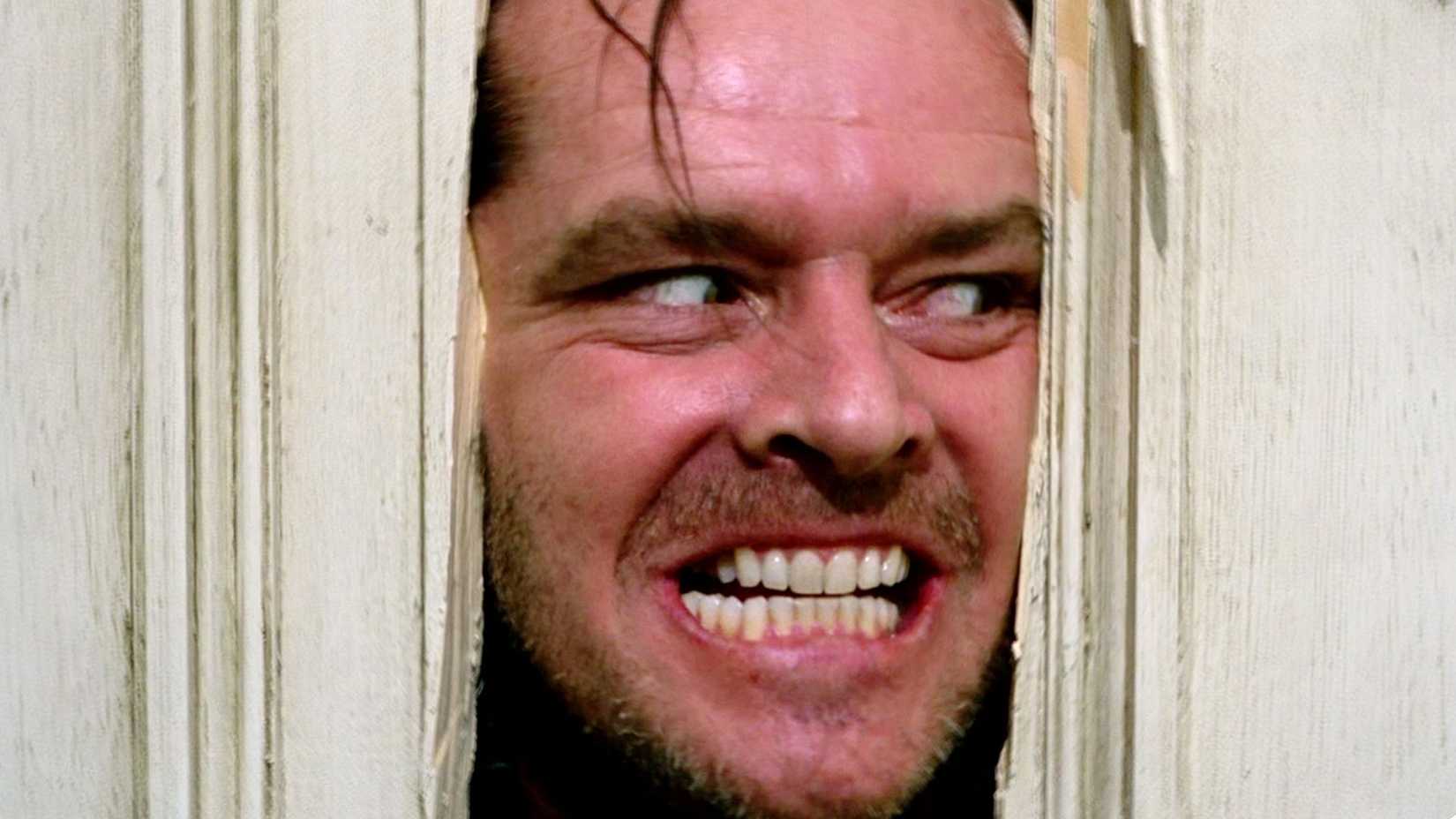 Jack Nicholson as Jack Torrance in the door in The Shining