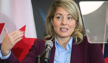 Melanie Joly speaks at microphone