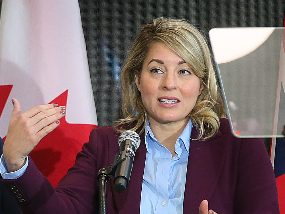 Melanie Joly speaks at microphone