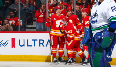 Flames ease past Canucks, push point streak to 6