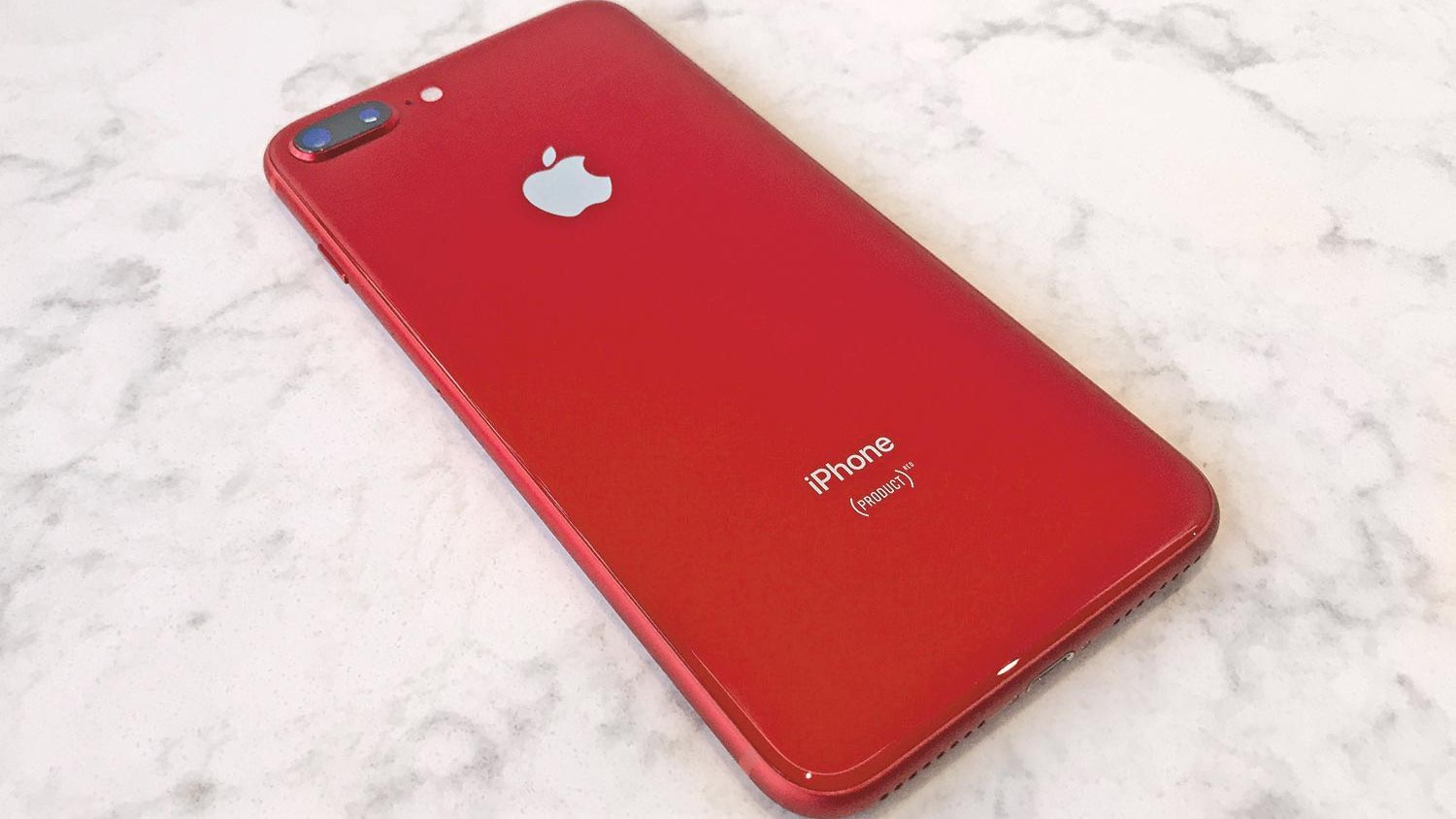 Red iPhone on a table