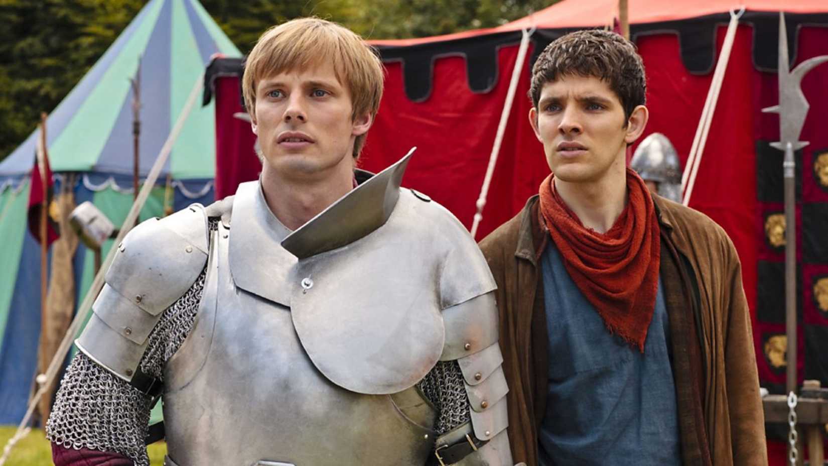 A knight in armor and a man wearing medieval peasant clothes in Merlin.