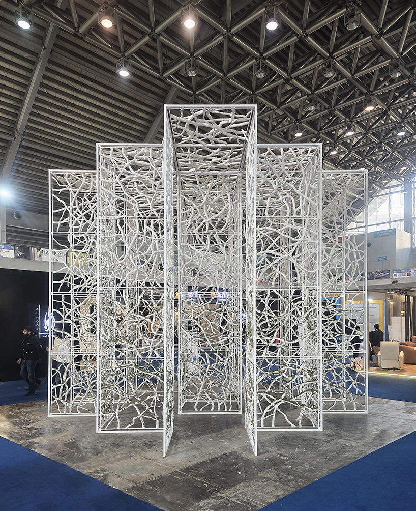 recycled paper waste turns into a branch-like lattice in a living spatial installation - 4