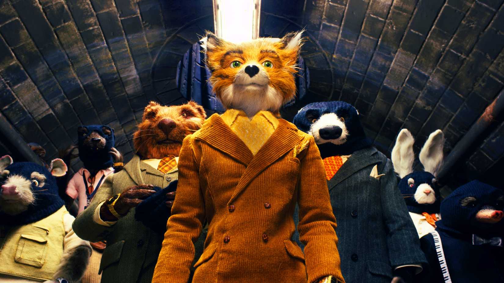 Mr. Fox standing in front of the other animals in a tunnel in Fantastic Mr. Fox