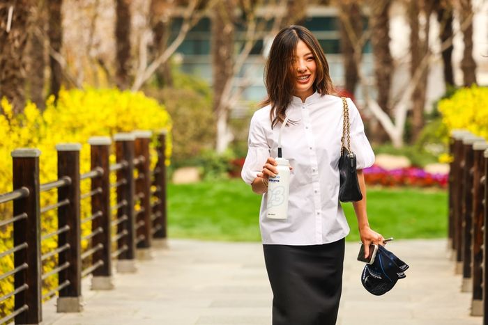 Muni He walks in the paddock.