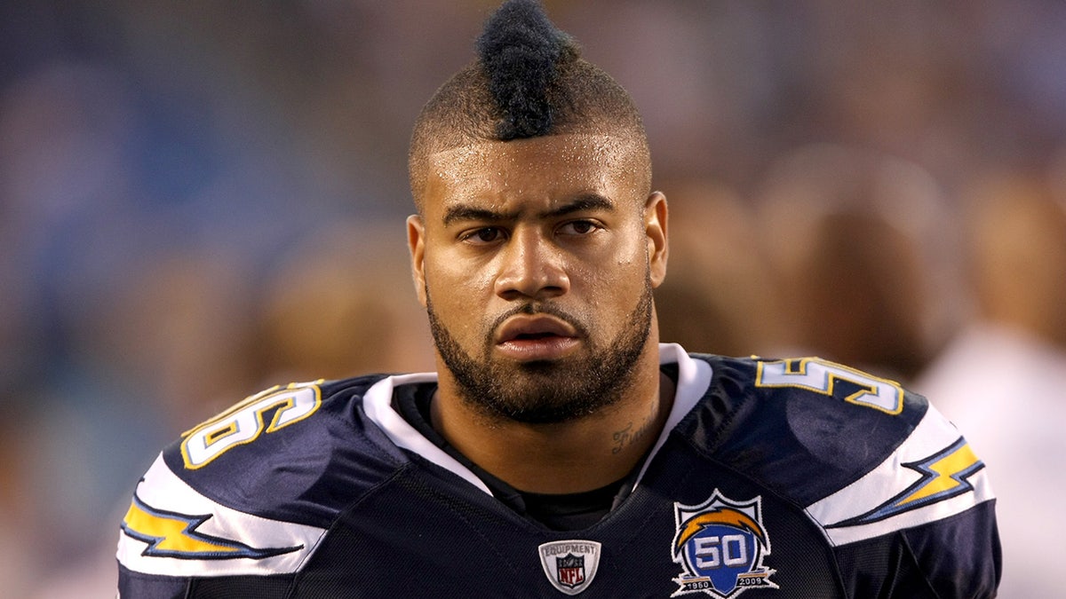 Shawne Merriman looks on