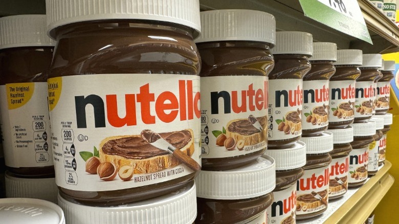 Jars of Nutella on a supermarket shelf.