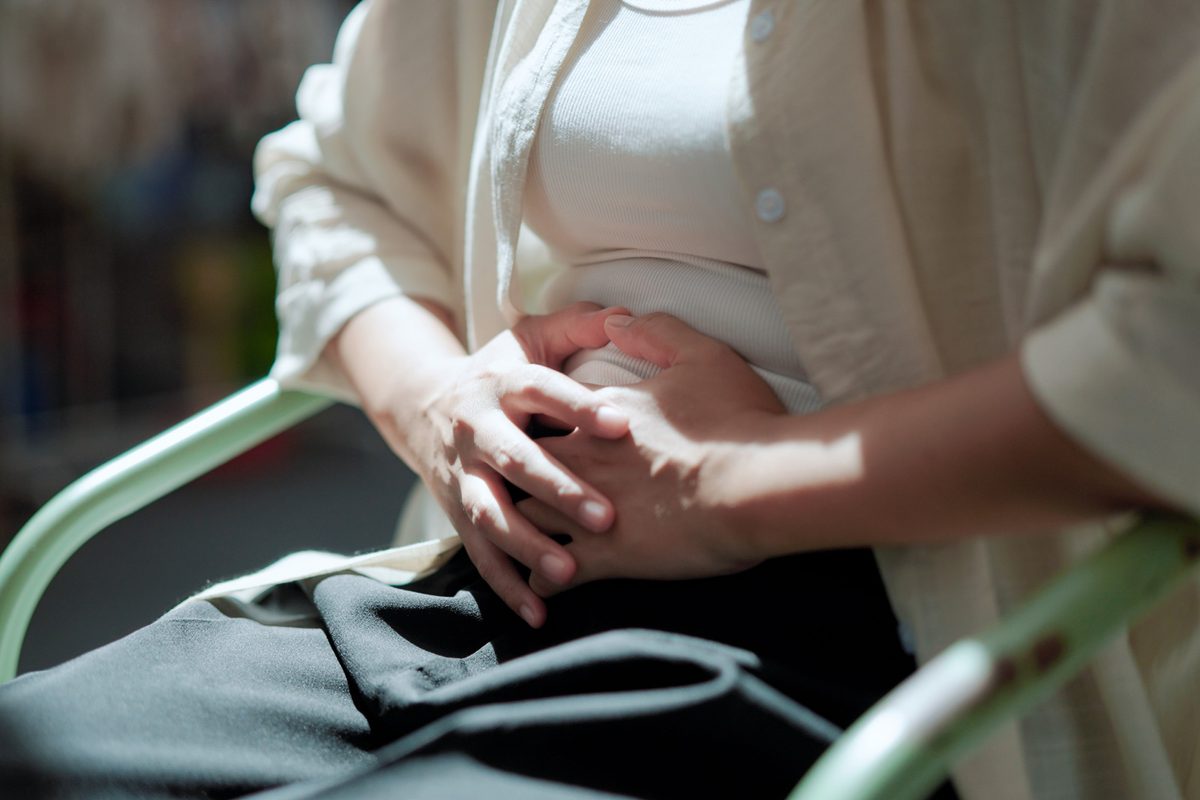 Woman feeling hurt at stomach.