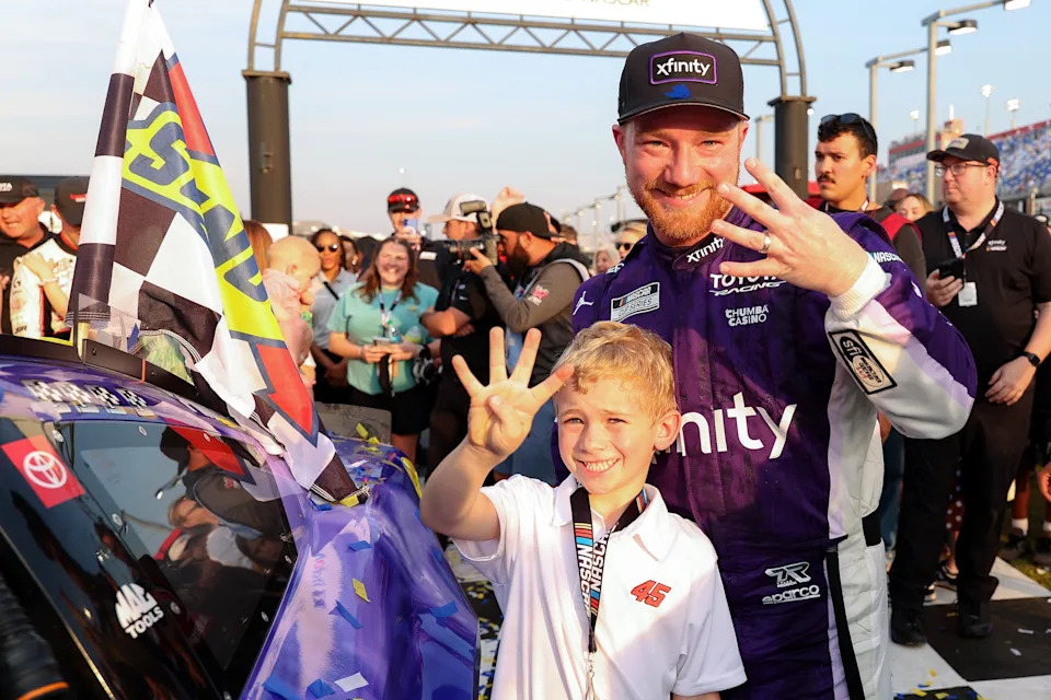 Tyler and his son, Beau, celebrate the win. (David Jensen/Getty Images)