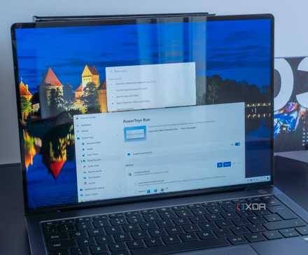 A Windows 11 laptop displaying PowerToys Run