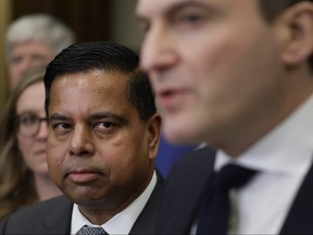 Public Safety Minister Gary Anandasangaree looks on as Artificial Intelligence and Digital Innovation Minister Evan Solomon speaks during a press conference on Parliament Hill in Ottawa on Wednesday, March 11, 2026.