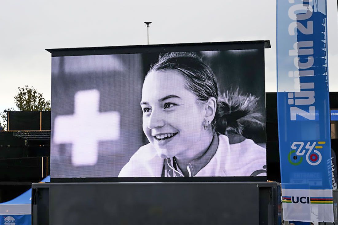 A black and white photo of Furrer is displayed on the big screen