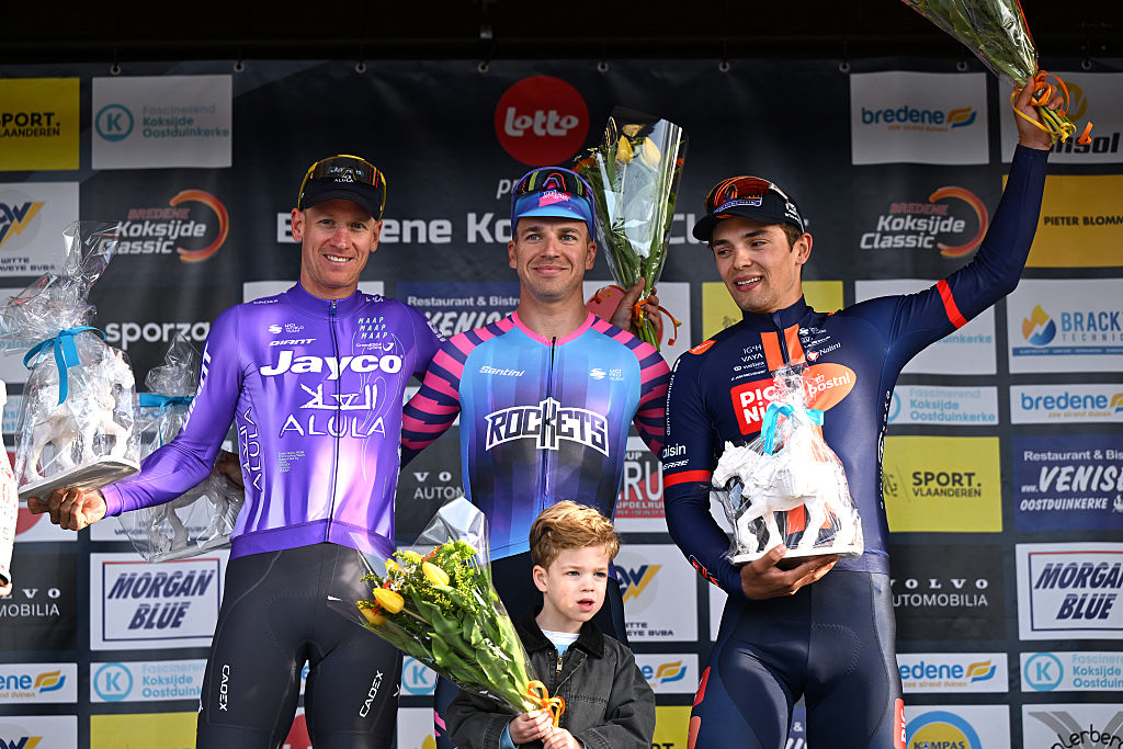 KOKSIJDE, BELGIUM - MARCH 20: (L-R) Pascal Ackermann of Germany and Team Jayco AlUla on second place, race winner Dylan Groenewegen of Netherlands and Team Unibet Rose Rockets and Pavel Bittner of Czech Republic and Team Picnic PostNL on third place pose on the podium ceremony after the 24th Bredene Koksijde Classic a 203.4km one day race from Oostende to Koksijde on March 20, 2026 in Koksijde, Belgium. (Photo by Luc Claessen/Getty Images)