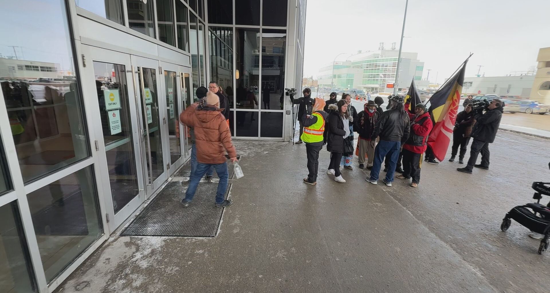 Supporters, family members rally outside a Winnipeg hotel following the eviction of an Indigenous family