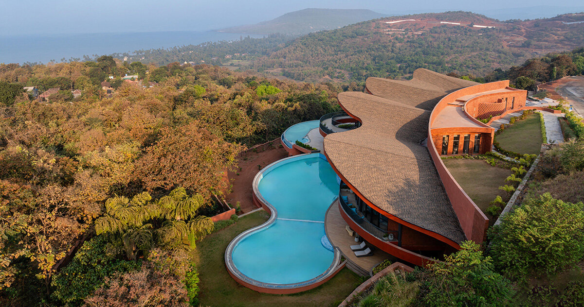 sanjay puri architects shapes 'crest nine' with a parabolic rooftop above the arabian sea