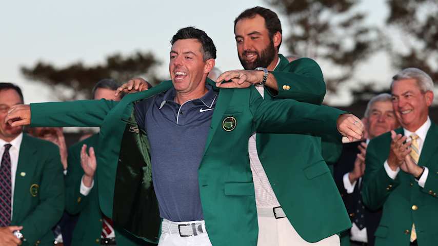 Scottie Scheffler places the green jacket on Rory McIlroy following his long-awaited win at the 2025 Masters Tournament. (Michael Reaves/Getty Images)