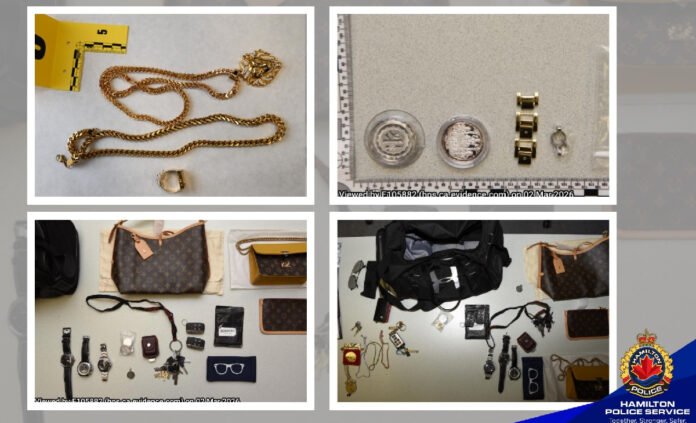 A four-panel police evidence display showing items believed to be recovered property. The top-left image shows two gold-coloured chain necklaces and a ring placed on a white surface beside a yellow evidence marker. The top-right image shows several watches and circular jewellery pieces arranged next to a measurement scale. The bottom-left image displays designer-style handbags, wallets, sunglasses, keys, and multiple wristwatches laid out in rows. The bottom-right image shows additional bags, jewellery, watches, and personal accessories arranged for documentation.