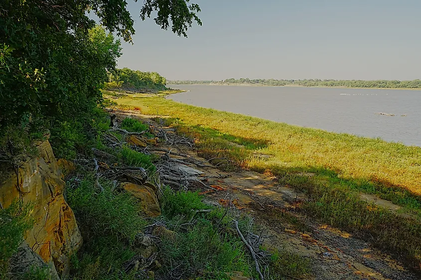 Scenic view at Kanopolis Lake State Park in Kansas with rolling hills, water, and natural vegetation.