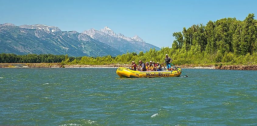 A group explores Snake River on inflatable raft, pictured here