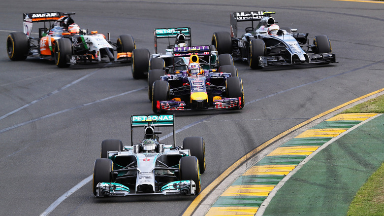 Nico Rosberg of Germany and Mercedes GP leads the field into the first corner at the start of the Australian Formula One Grand Prix at Albert Park on March 16, 2014 in Melbourne, Australia.