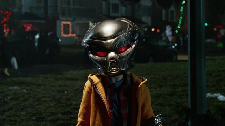 Rory (Jacob Tremblay) wearing a Yautja helmet in The Predator