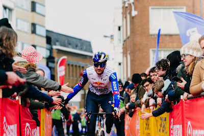 Tim van Dijke of Red Bull – BORA – hansgrohe greets fans during the 78th Kuurne - Brussel - Kuurne cycling event in Belgium. 