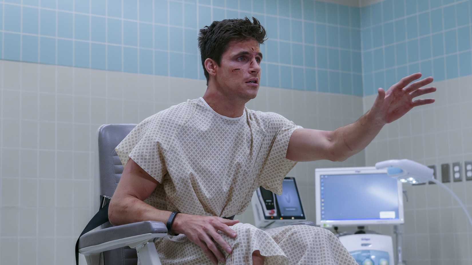 Robbie Amell sitting in a wheelchair looking upset in Prime Video's Upload (2020-2025)