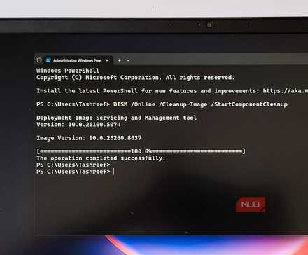 Windows terminal open with DISM command open on a HP Pavillion laptop