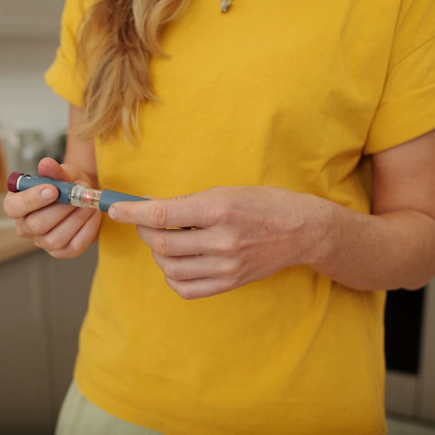 woman holding expensive EpiPen