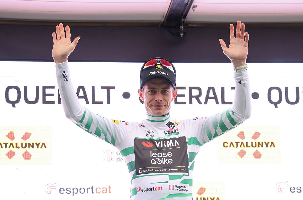 Jonas Vingegaard celebrates on the podium after winning stage 6 at Volta a Catalunya