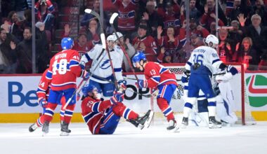 Apr 9, 2026; Montreal, Quebec, CAN; Montreal Canadiens forward Juraj Slafkovsky (20) celebrates with teammates including forward Cole Caufield (13) after scoring a goal against the Tampa Bay Lightning during the third period at the Bell Centre. Mandatory Credit: Eric Bolte-Imagn Images