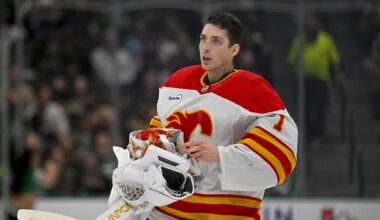 Apr 7, 2026; Dallas, Texas, USA; Calgary Flames goaltender Devin Cooley (1) skates back on the ice during the second period against the Dallas Stars at the American Airlines Center. Mandatory Credit: Jerome Miron-Imagn Images