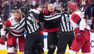 Apr 25, 2026; Ottawa, Ontario, CAN; Tensions rise as Carolina Hurricanes left wing Nicolas Deslauriers (44) fights with Ottawa Senators left wing Brady Tkachuk (7) in the second period of game four of the first round of the 2026 Stanley Cup Playoffs at the Canadian Tire Centre. Mandatory Credit: Marc DesRosiers-Imagn
